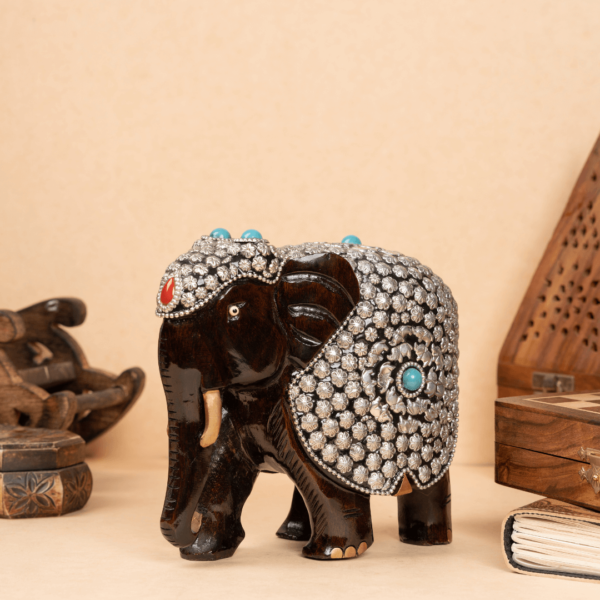 https://suryaarthandicrafts.com/wp-content/uploads/2024/12/WOODEN-ELEPHANT-METAL-JADAI-WORK-600x600.png