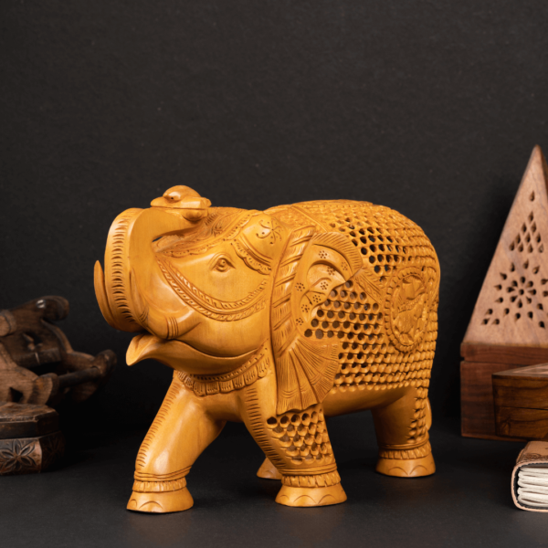 https://suryaarthandicrafts.com/wp-content/uploads/2024/12/WOODEN-FAIN-CARVING-ELEPHANT-1-600x600.png