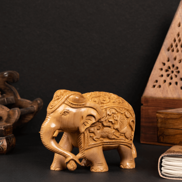 https://suryaarthandicrafts.com/wp-content/uploads/2024/12/WOODEN-FAIN-CARVING-ELEPHANT-600x600.png