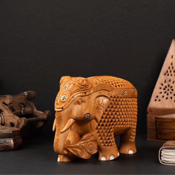 https://suryaarthandicrafts.com/wp-content/uploads/2024/12/WOODEN-FAIN-INLY-JALI-ELEPHANT-600x600.png