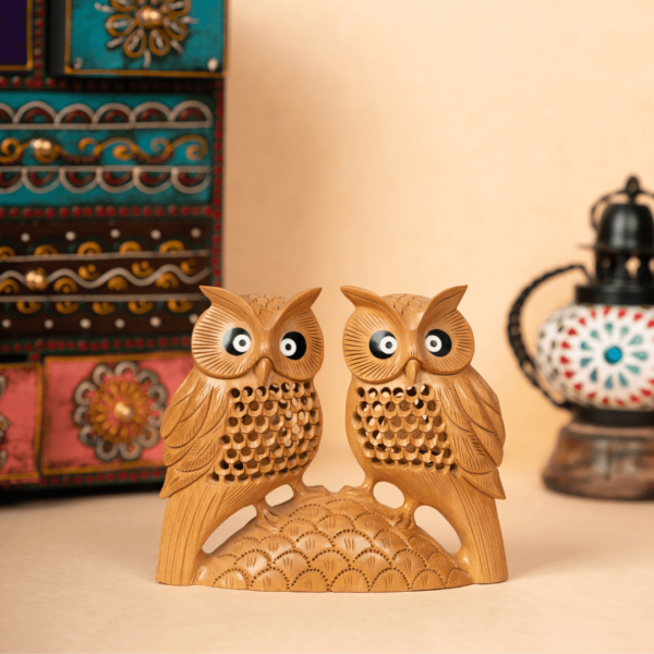 https://suryaarthandicrafts.com/wp-content/uploads/2024/12/WOODEN-FAIN-JALI-CARVING-OWL-PAIR-600x600.png