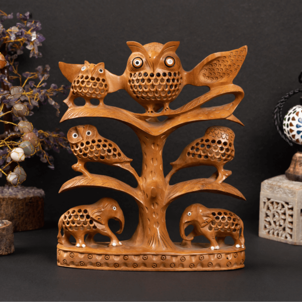 https://suryaarthandicrafts.com/wp-content/uploads/2024/12/WOODEN-FAIN-JALI-TREE-OWL-FAMILY-600x600.png