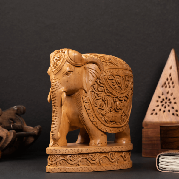 https://suryaarthandicrafts.com/wp-content/uploads/2024/12/WOODEN-FAIN-SHIKAR-CARVING-ELEPHANT-600x600.png