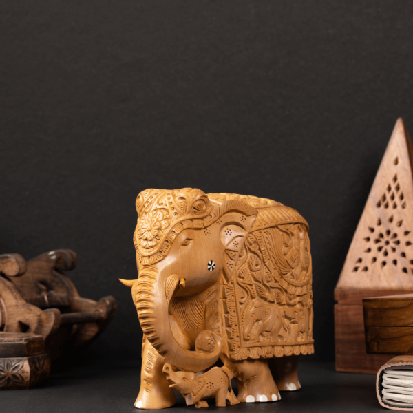 https://suryaarthandicrafts.com/wp-content/uploads/2024/12/WOODEN-FAIN-SHIKAR-CARVING-ELEPHNAT-600x600.png