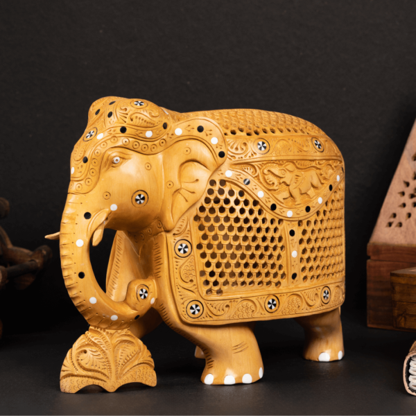 https://suryaarthandicrafts.com/wp-content/uploads/2024/12/WOODEN-JALI-CARVING-INLY-WORK-ELEPHANT-600x600.png